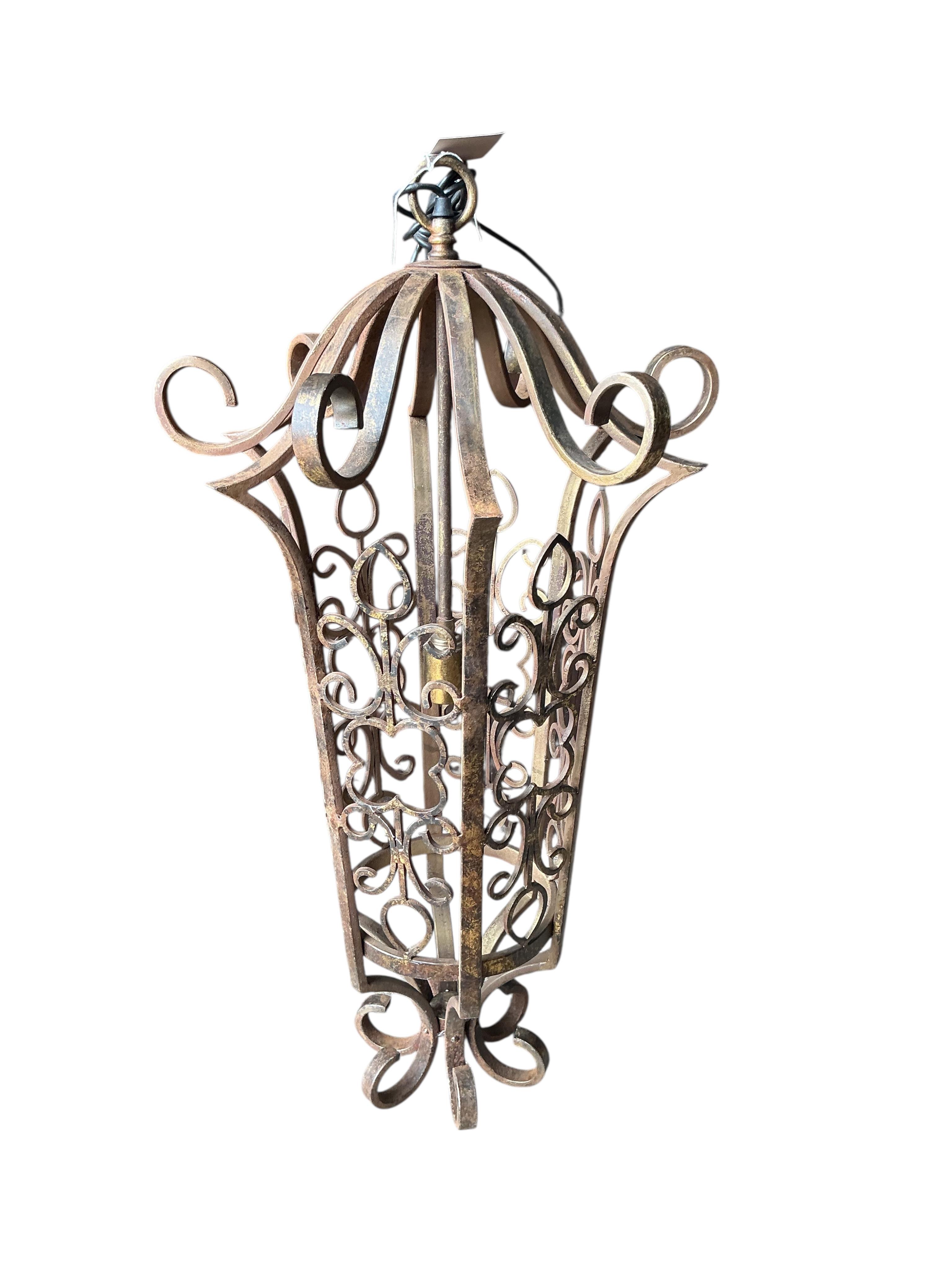 A wrought iron hexagonal hall lantern, height 90cm